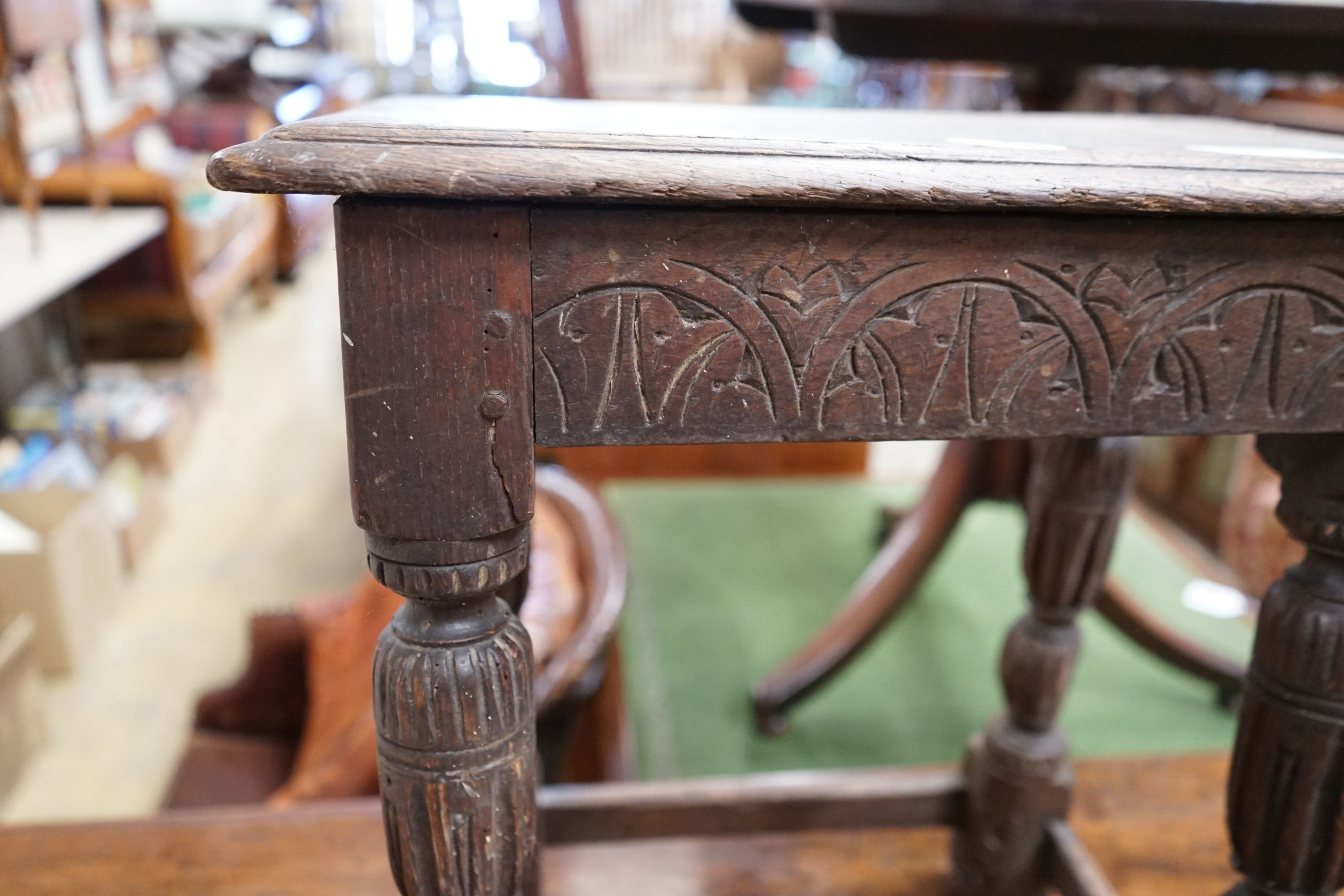 An oak joint stool (wormed), width 45cm, depth 27cm, height 52cm